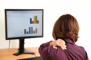 Cervical osteochondrosis in women sitting at a computer
